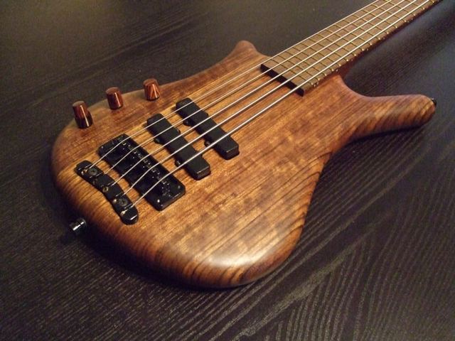 Five-string bass with a figured wood top